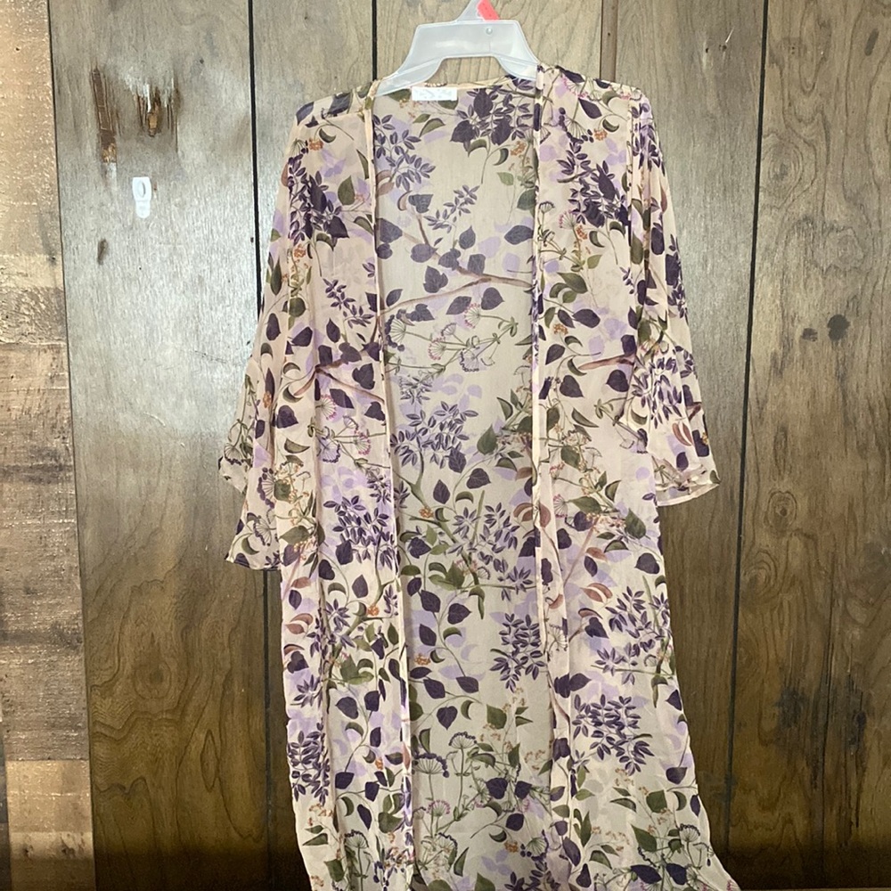This is a floral shaw size medium and fits very comfortably and loose